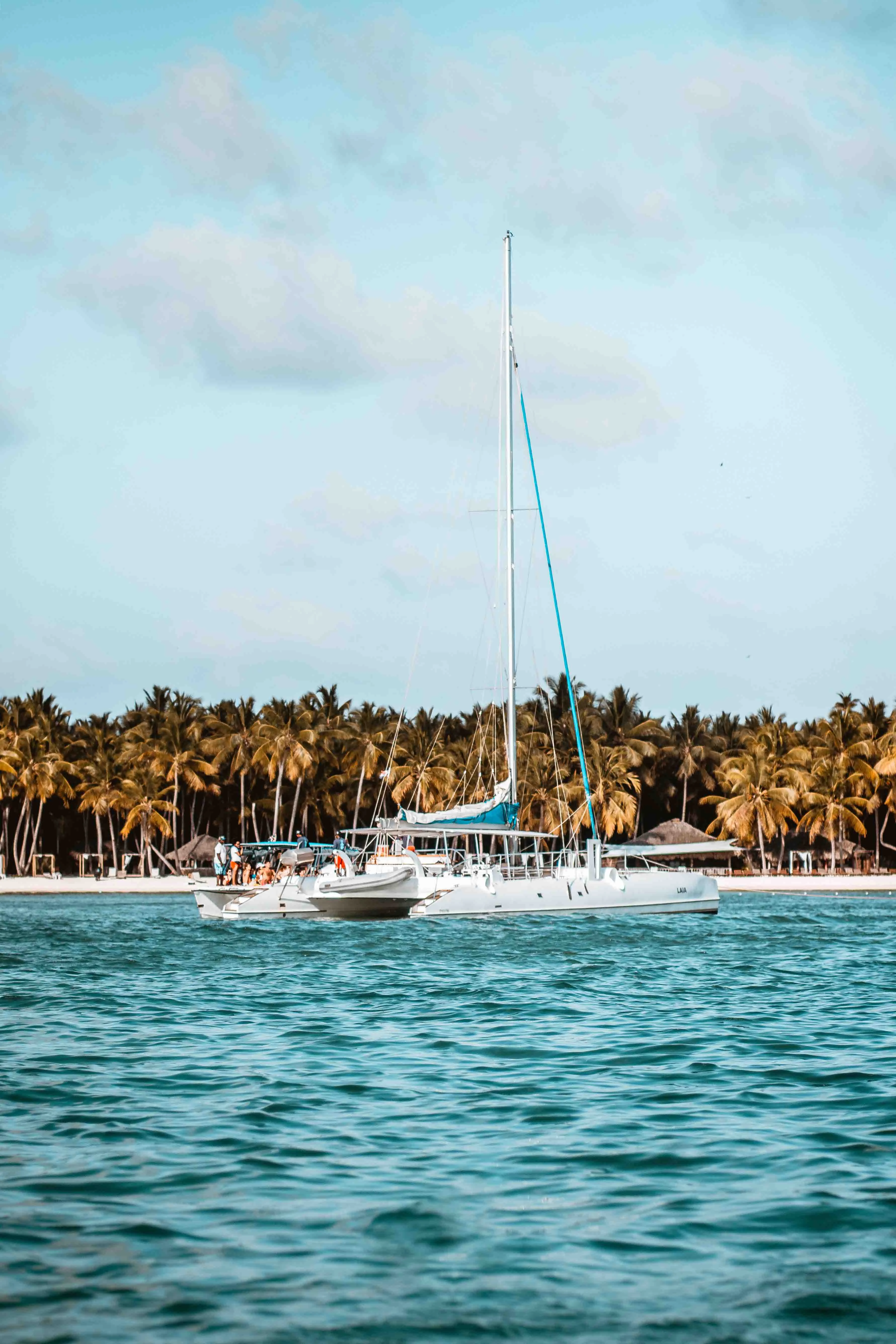Sailboat anchored in turquoise water near Casa de Campo