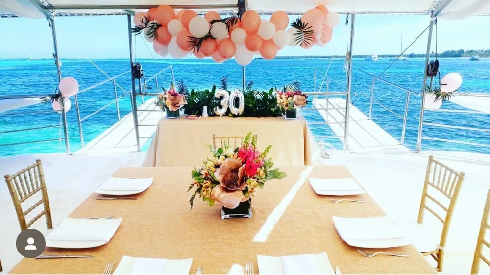 Birthday table and balloons overlooking the Caribbean Sea