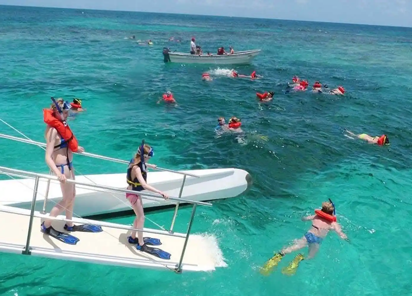 Catamaran cruising along the Punta Cana coast with guests on deck