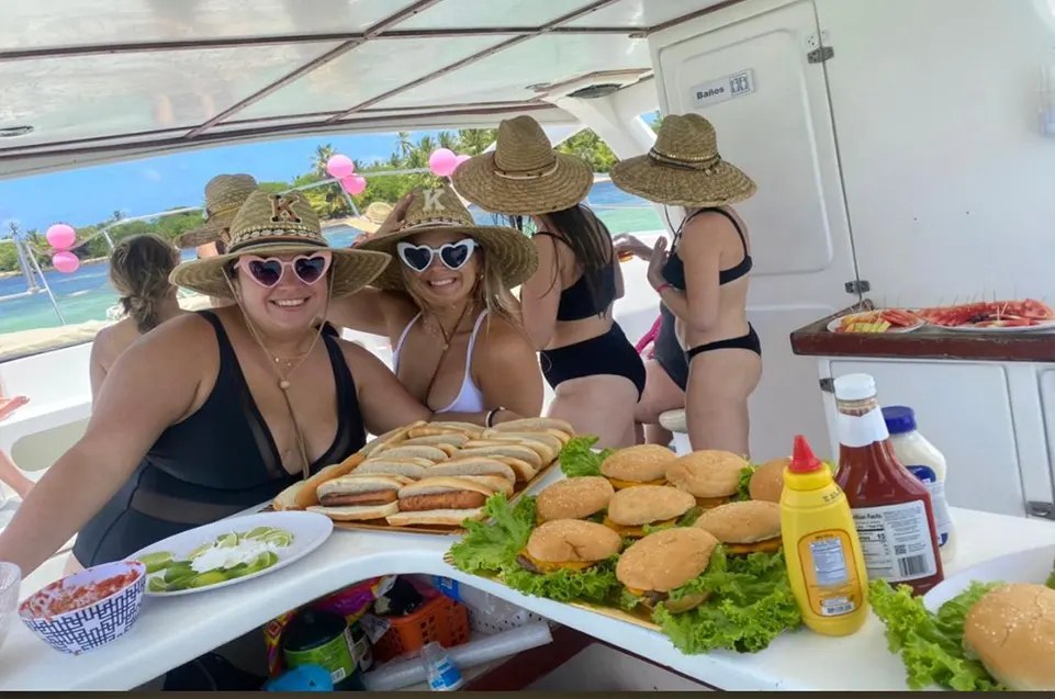 Family posing for photos on a catamaran rental in Punta Cana